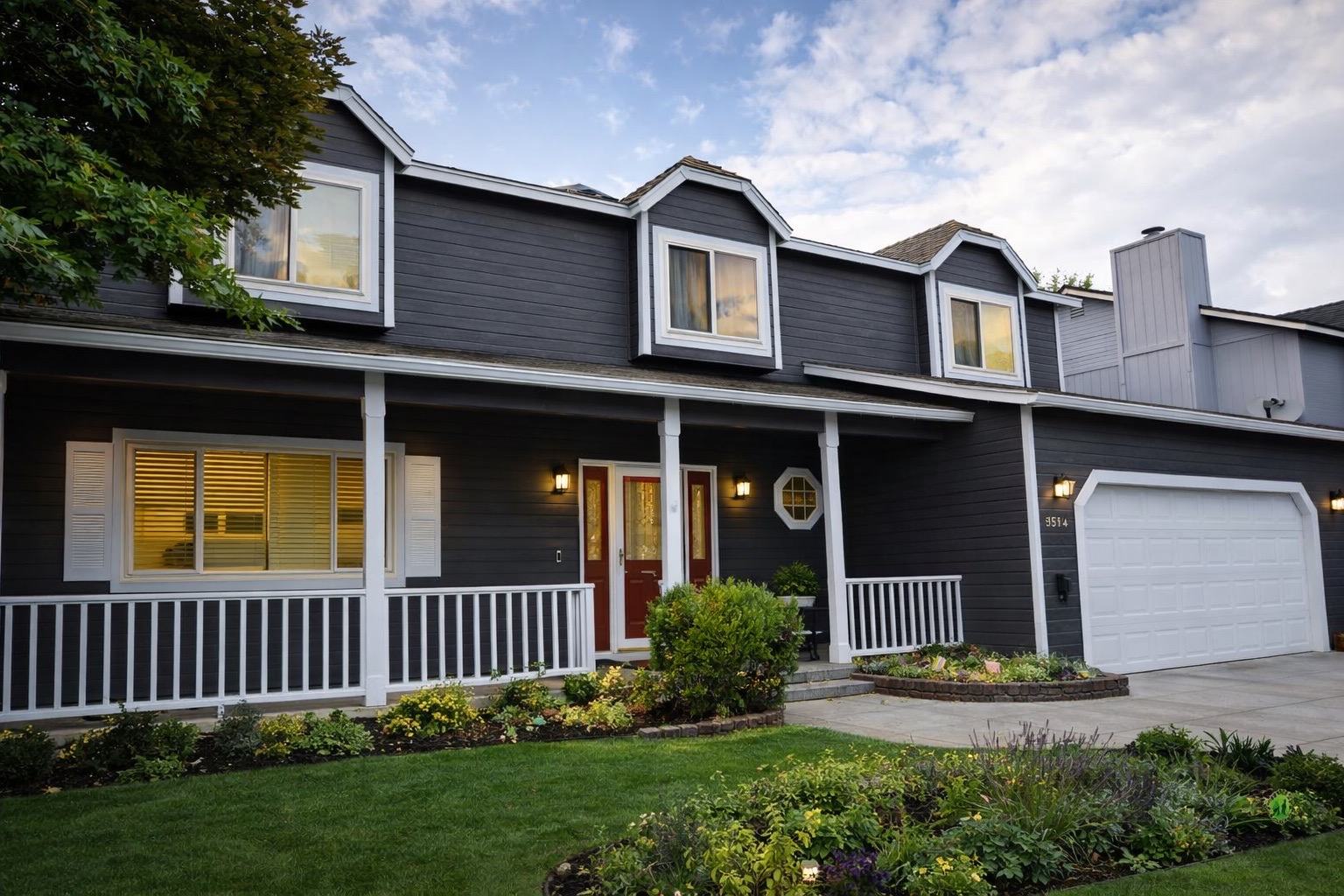 Dark gray home exterior painted by Silverland Innovation Coatings